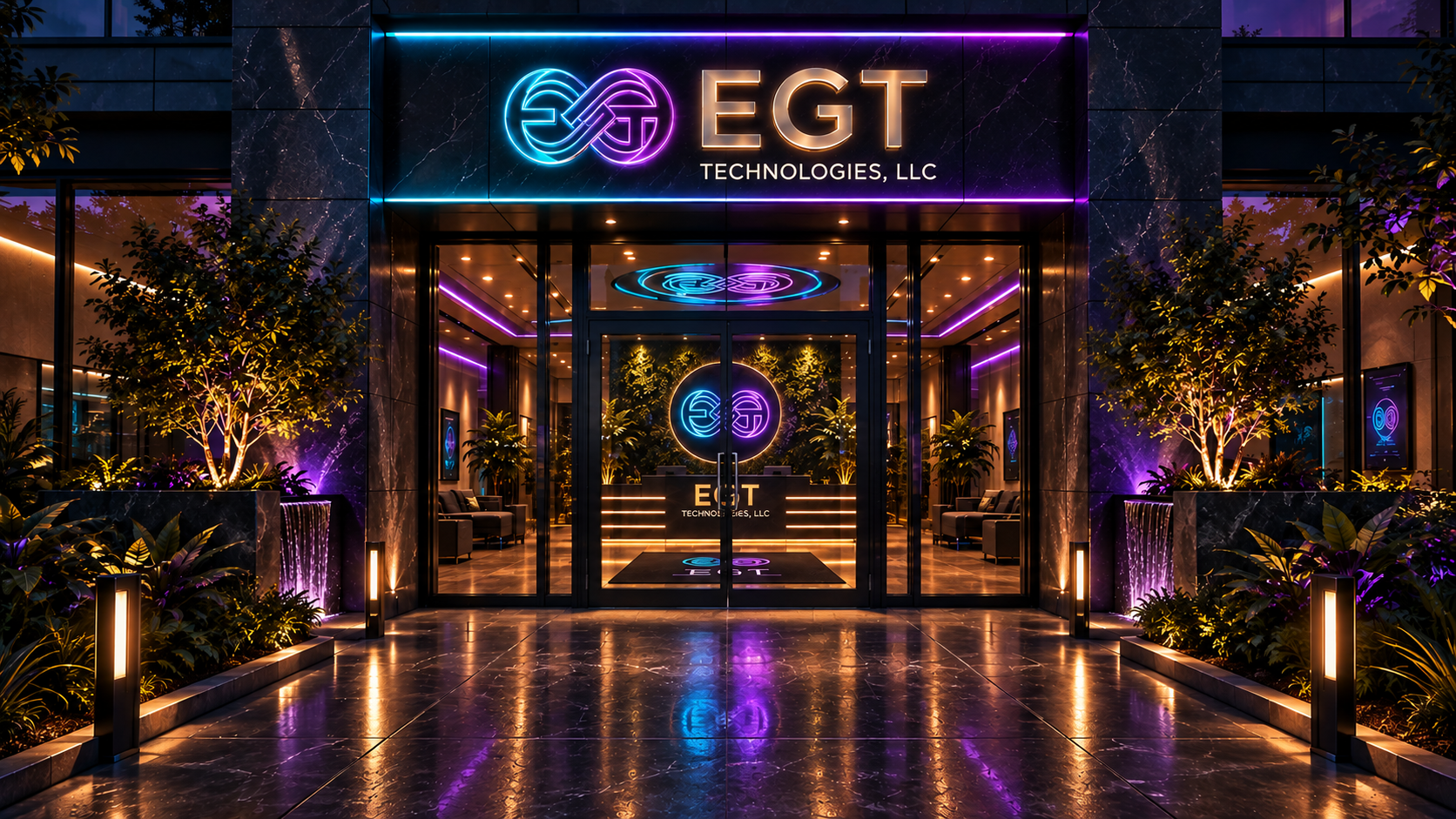 The EGT Technologies building entrance at dusk, with a glowing EGT sign above the glass doors.